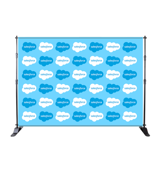 Step and repeat banner with Salesforce logo on a blue background